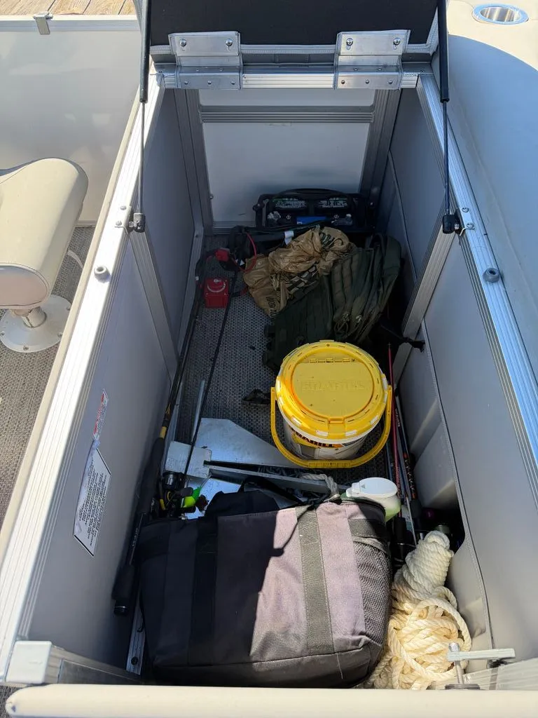 Slide: The Image of Storage compartment in Bennington SX 22 boat with gear, 2023 model. - 16