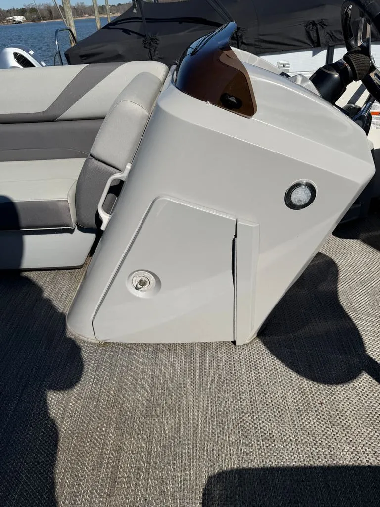 Slide: The Image of 2023 Bennington SX 22 boat console with gray seating area. - 20