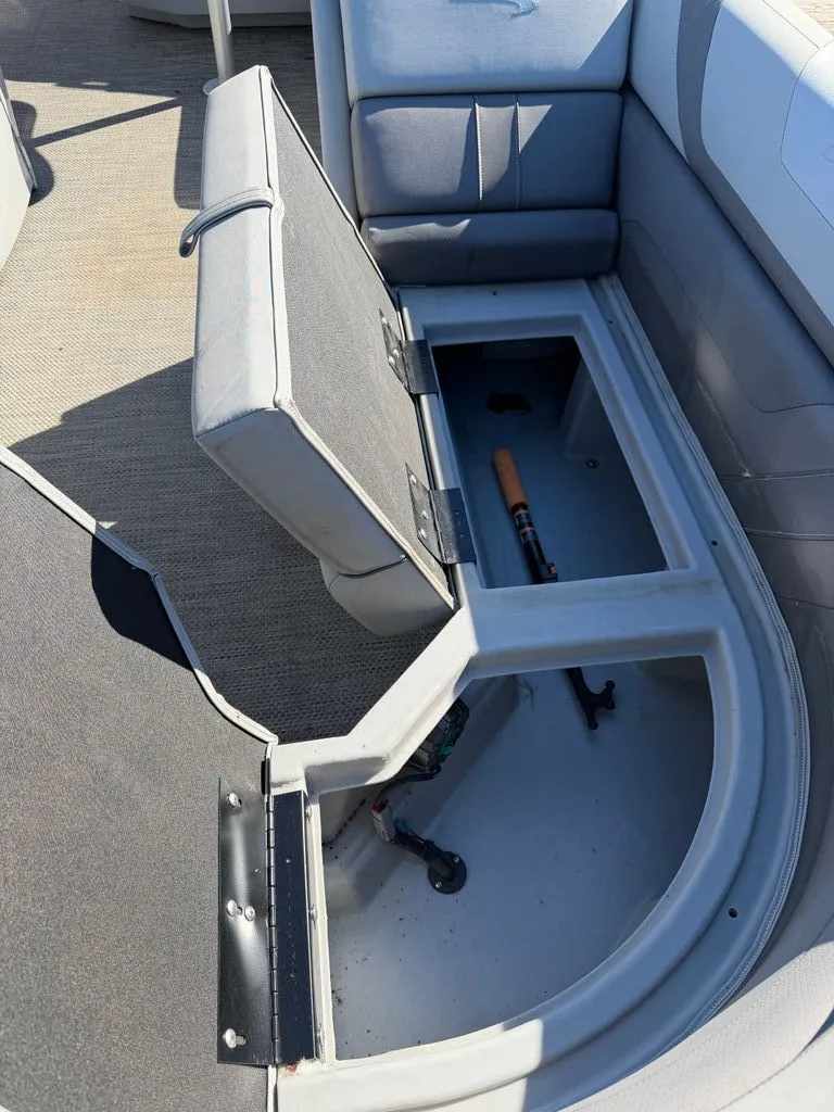 Slide: The Image of Open storage compartment in 2023 Bennington SX 22 boat. - 3