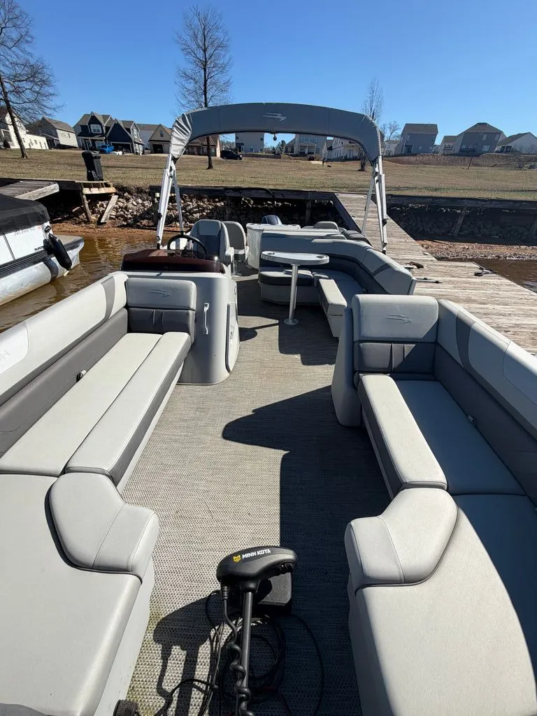 Slide: The Image of 2023 Bennington SX 22 pontoon boat at dock, interior view. - 32