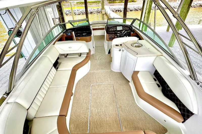 Slide: The Image of Luxurious interior of a 2016 Cobalt 302 boat with plush seating and modern amenities. - 22