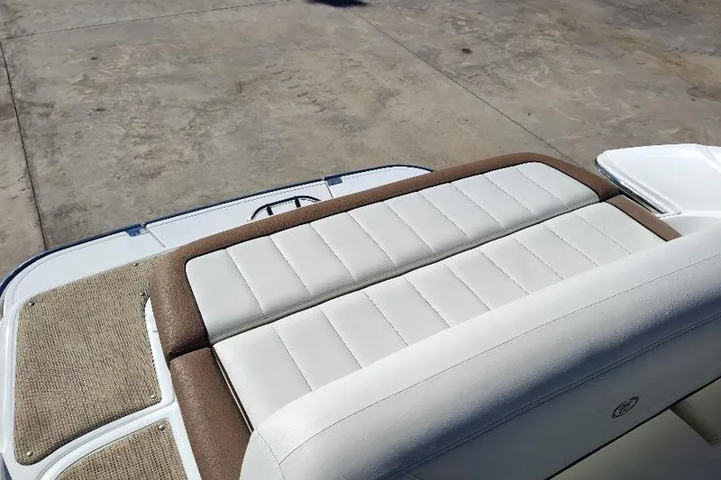 Slide: The Image of Rear seating area of a 2016 Cobalt 302 boat with beige upholstery. - 24