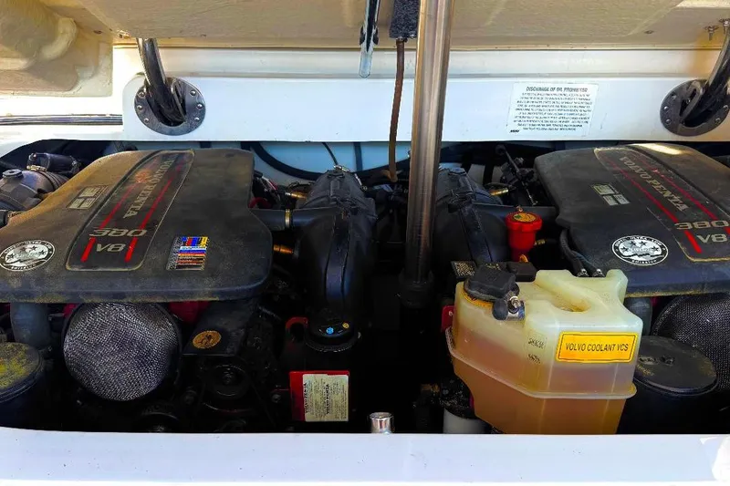 Slide: The Image of Engine compartment of a 2016 Cobalt 302 boat with dual V8 engines. - 31
