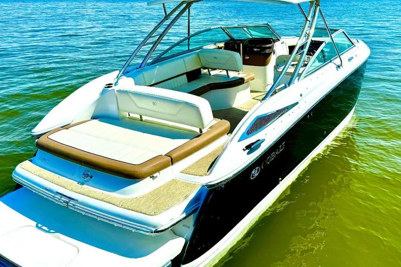 Slide: The Image of 2016 Cobalt 302 boat on water, featuring sleek design and spacious seating. - 4