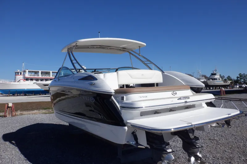 Slide: The Image of 2016 Cobalt 302 boat on display, featuring sleek design and spacious deck. - 7