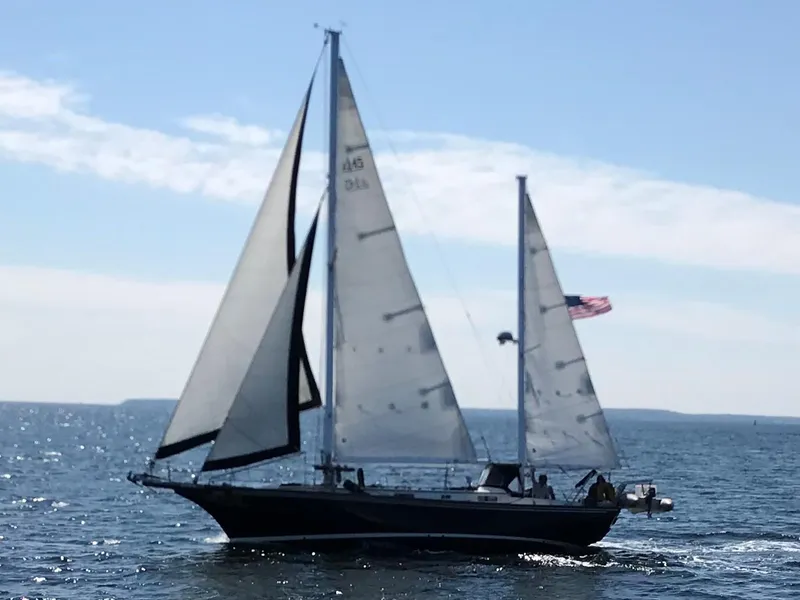 Slide: The Image of 1977 Fuji 45 MK II Ketch sailing on open sea. - 1