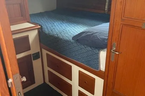 Slide: The Image of Interior of a 1977 Fuji 45 MK II Ketch with wooden furnishings. - 10