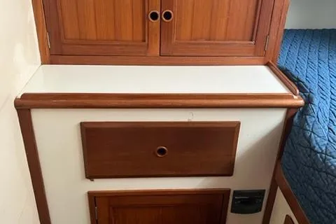 Slide: The Image of 1977 Fuji 45 MK II Ketch interior with wooden cabinets. - 19