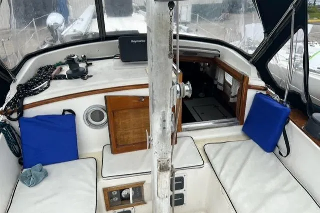 Slide: The Image of Interior of a 1977 Fuji 45 MK II Ketch with blue cushions. - 26