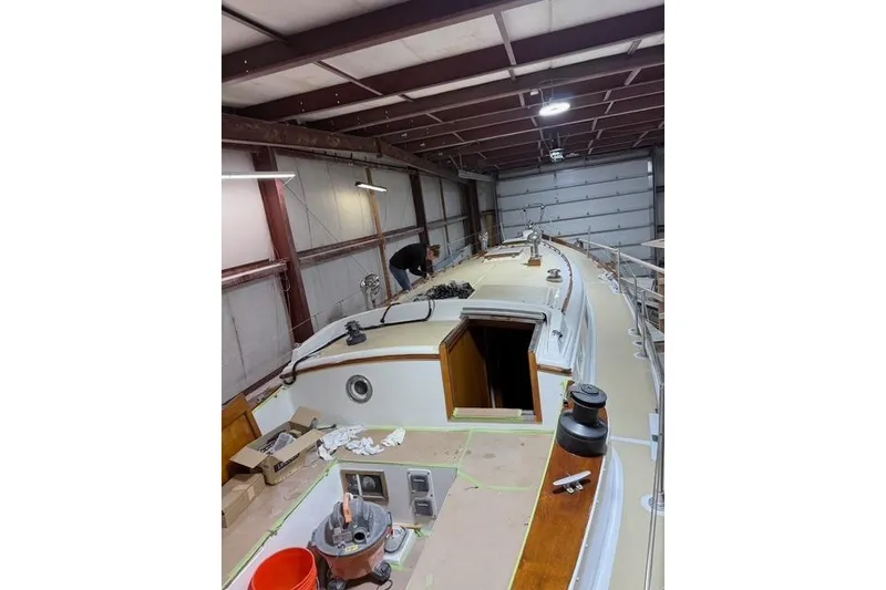 Slide: The Image of 1977 Fuji 45 MK II Ketch in a workshop, undergoing maintenance and repairs. - 32
