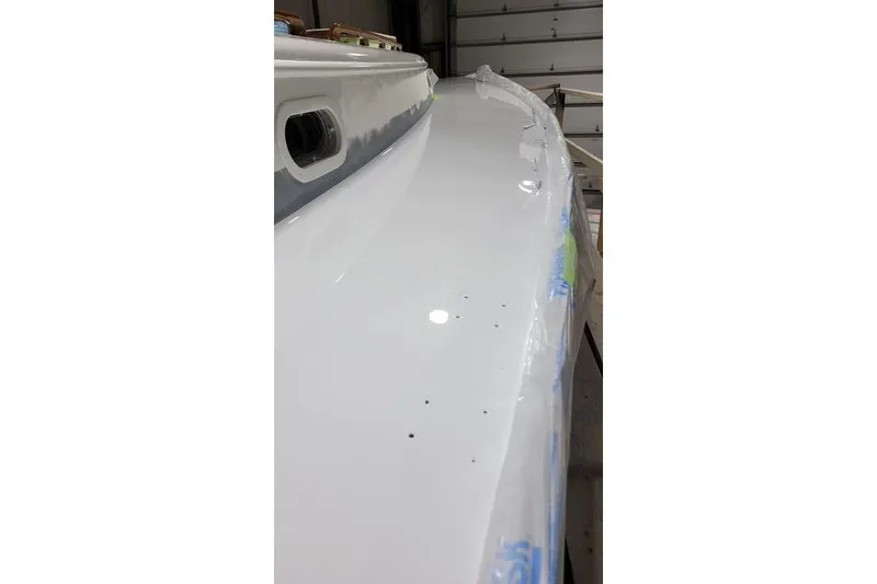 Slide: The Image of Close-up of a 1977 Fuji 45 MK II Ketch boat deck in a workshop. - 33