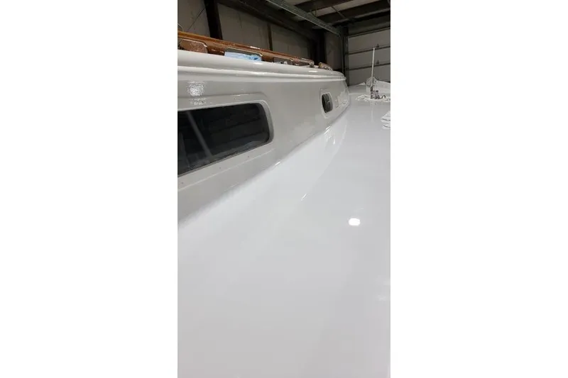 Slide: The Image of 1977 Fuji 45 MK II Ketch sailboat deck in a storage facility. - 34