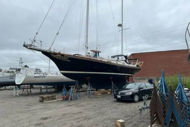 Slide: The Image of 1977 Fuji 45 MK II Ketch docked in harbor. - 45