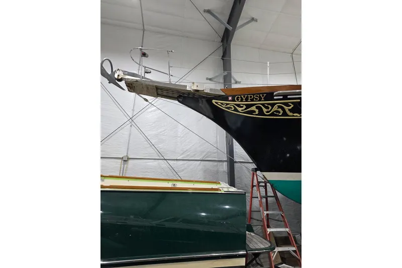 Slide: The Image of 1977 Fuji 45 MK II Ketch named "Gypsy" in indoor storage, detailed bow design. - 50