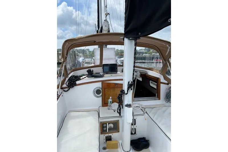 Slide: The Image of Cockpit of 1977 Fuji 45 MK II Ketch sailboat with navigation equipment and seating. - 61