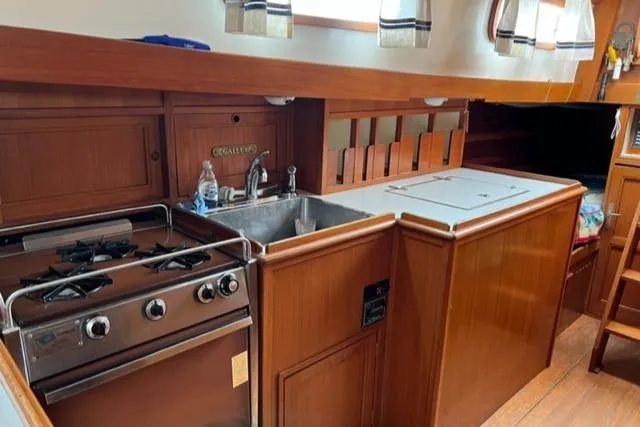 Slide: The Image of Interior of 1977 Fuji 45 MK II Ketch featuring kitchen area. - 8