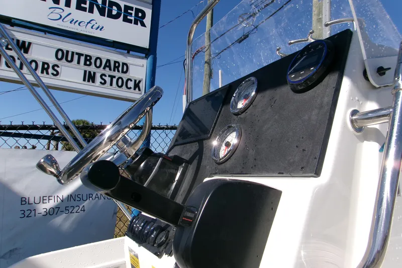 Slide: The Image of 2026 Key West 1720 Center Console boat dashboard with steering wheel and gauges. - 16