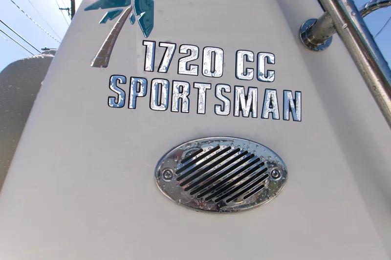 Slide: The Image of 2026 Key West 1720 Center Console boat with "Sportsman" branding and chrome vent detail. - 25