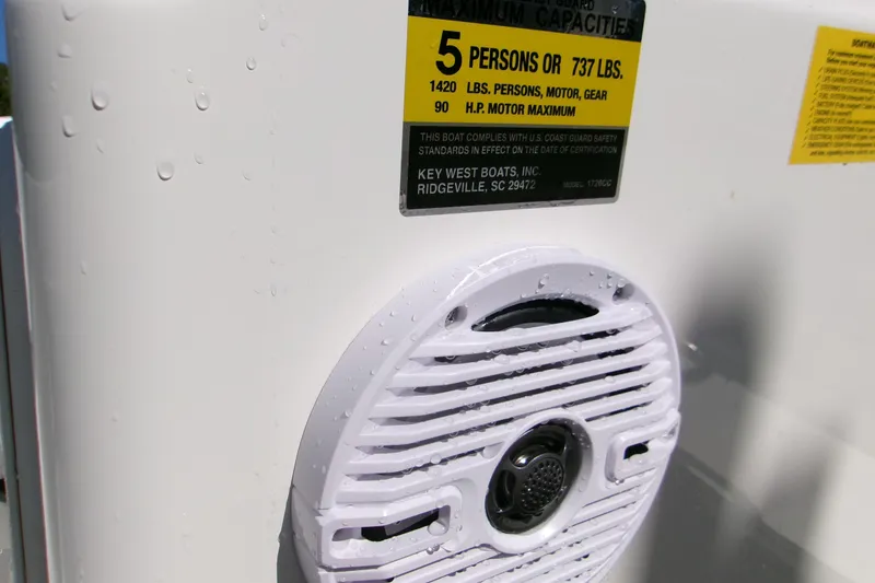 Slide: The Image of 2026 Key West 1720 Center Console boat capacity label and speaker detail. - 8