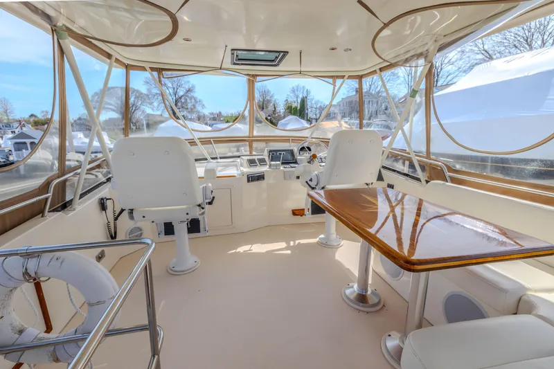 Slide: The Image of Interior view of 2002 Sabreline 47 yacht with helm and seating area. - 14