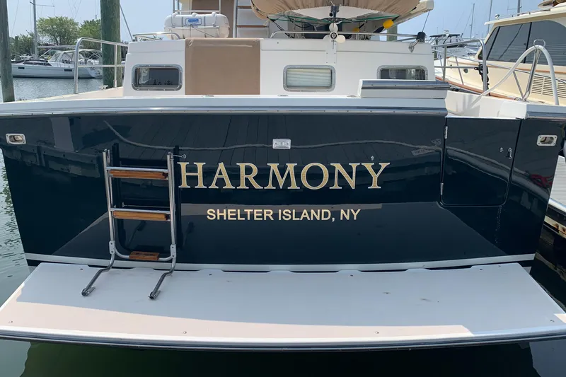 Slide: The Image of 2002 Sabreline 47 yacht named "Harmony" docked at Shelter Island, NY. - 16