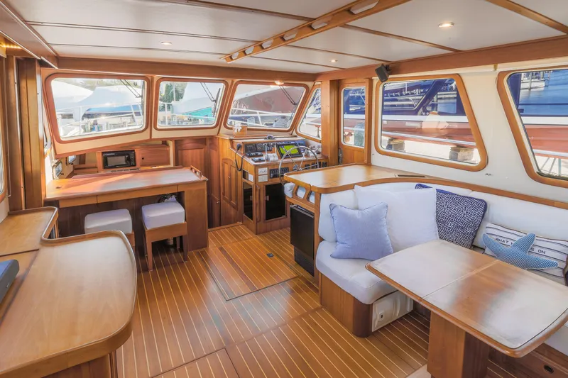 Slide: The Image of Luxurious interior of 2002 Sabreline 47 yacht with wooden furnishings and plush seating. - 7
