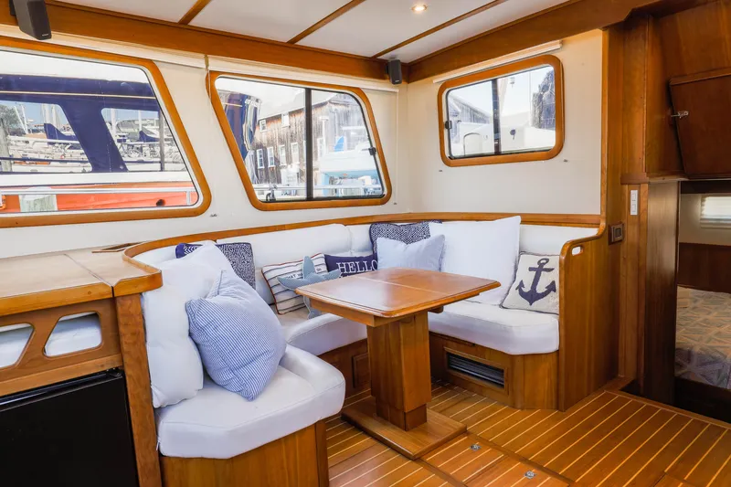 Slide: The Image of Luxurious interior of 2002 Sabreline 47 yacht with cozy seating and nautical decor. - 8