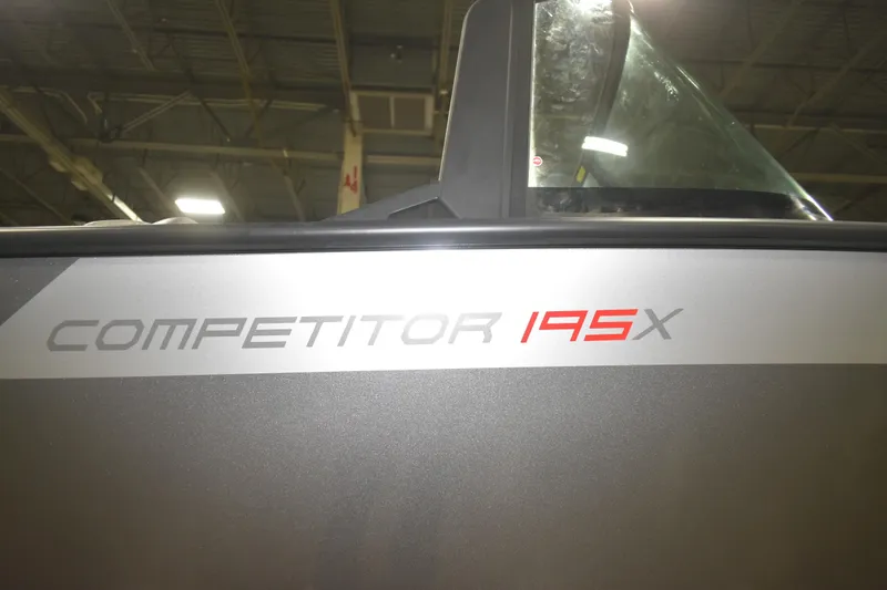 Slide: The Image of 2026 Alumacraft Competitor 195X Sport boat detail in indoor lighting. - 16
