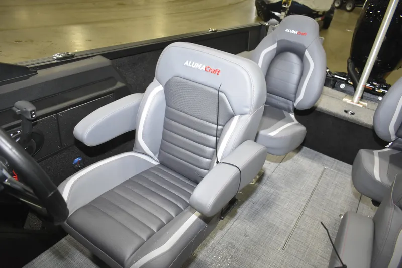 Slide: The Image of 2026 Alumacraft Competitor 195X Sport boat interior with gray cushioned seats. - 8