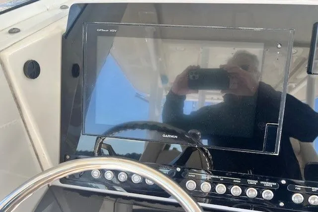 Slide: The Image of Control panel of a 2018 Everglades 335 Center Console boat with Garmin display. - 10