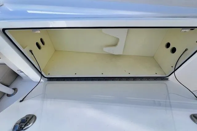 Slide: The Image of Open storage compartment on 2018 Everglades 335 Center Console boat. - 17