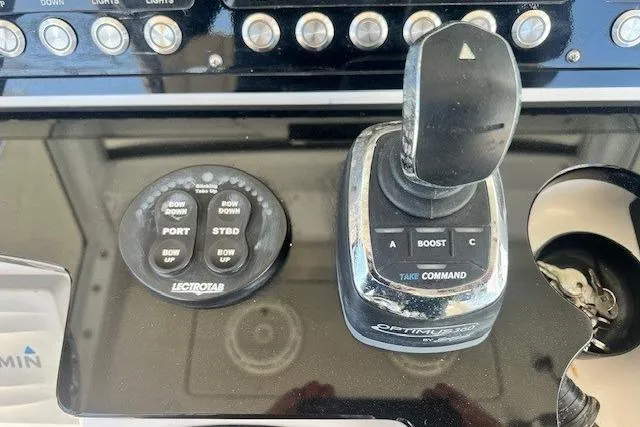 Slide: The Image of Control panel of 2018 Everglades 335 Center Console boat with joystick and buttons. - 24