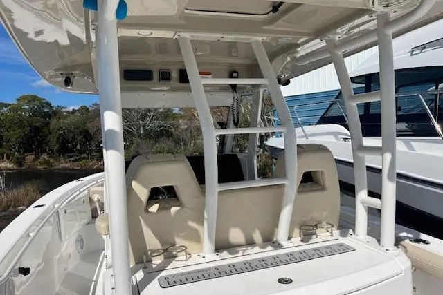Slide: The Image of 2018 Everglades 335 Center Console boat interior with seating and console view. - 33
