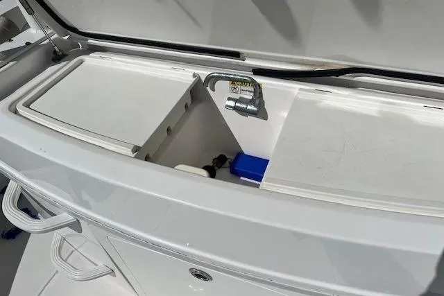 Slide: The Image of 2018 Everglades 335 Center Console boat sink and storage compartment. - 35