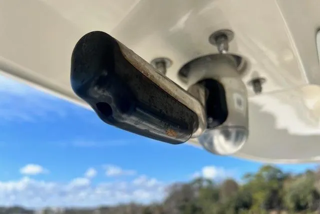 Slide: The Image of Close-up of Everglades 335 Center Console boat hardware, 2018 model, against a blue sky. - 38