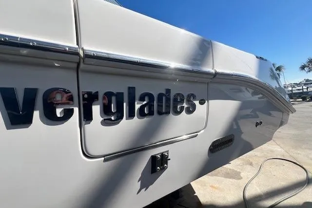 Slide: The Image of 2018 Everglades 335 Center Console boat, side view with logo in sunlight. - 4