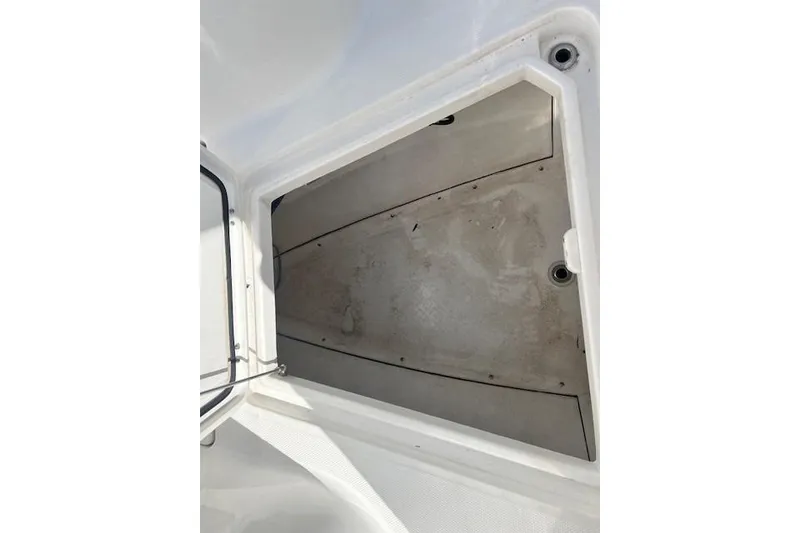 Slide: The Image of Storage compartment of 2018 Everglades 335 Center Console boat, open and empty. - 44
