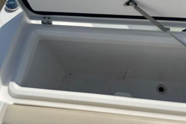 Slide: The Image of Open storage compartment on 2018 Everglades 335 Center Console boat. - 49