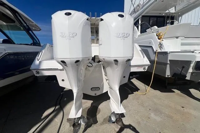 Slide: The Image of 2018 Everglades 335 Center Console with twin 350 horsepower outboard engines. - 5