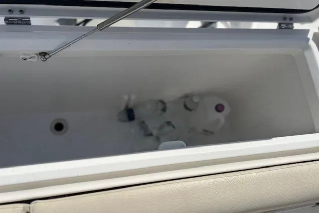 Slide: The Image of Open cooler on 2018 Everglades 335 Center Console boat with bottles inside. - 50