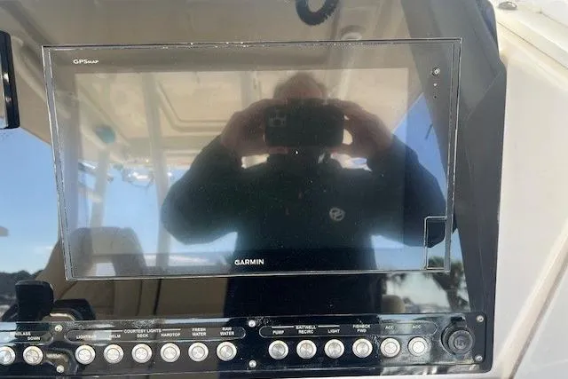 Slide: The Image of Garmin GPS display on 2018 Everglades 335 Center Console boat dashboard. - 9