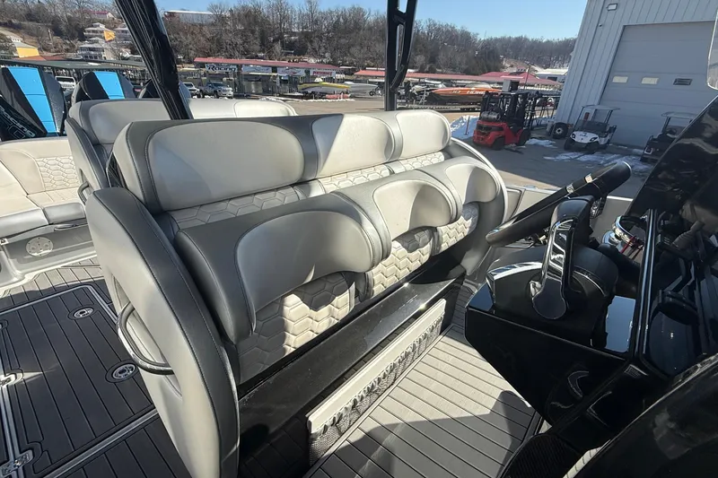Slide: The Image of 2023 Nor-Tech 390 Sport Center Console interior with modern seating and steering console. - 15