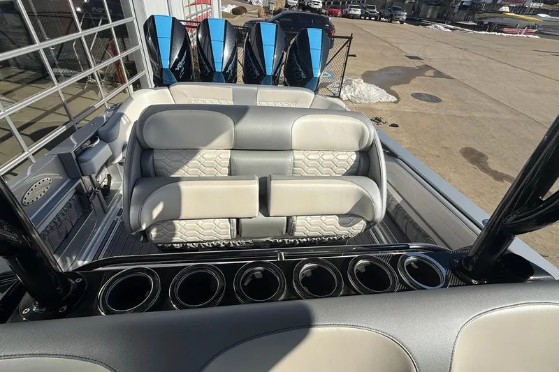 Slide: The Image of 2023 Nor-Tech 390 Sport Center Console with luxurious seating and powerful engines. - 16