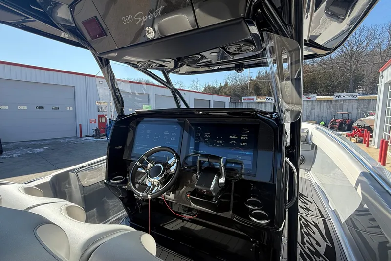Slide: The Image of 2023 Nor-Tech 390 Sport Center Console helm with modern controls and sleek design. - 20