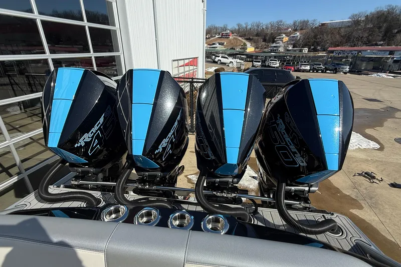 Slide: The Image of 2023 Nor-Tech 390 Sport Center Console with four powerful outboard engines. - 26