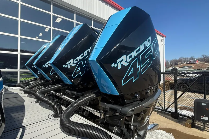 Slide: The Image of 2023 Nor-Tech 390 Sport Center Console with triple Racing 450 engines. - 6