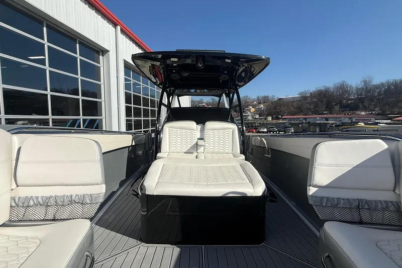 Slide: The Image of 2023 Nor-Tech 390 Sport Center Console boat with luxurious seating and sleek design. - 9