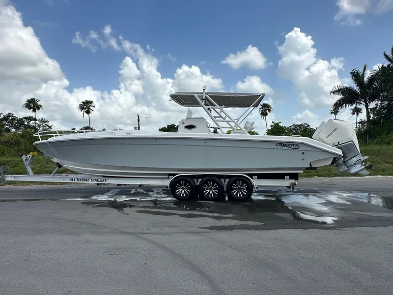 Slide: The Image of 2006 Dakota 36 Cuddy boat on trailer, side view. - 12