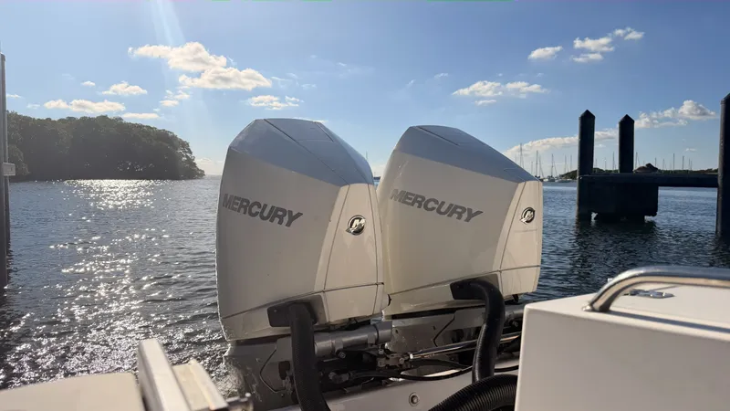 Slide: The Image of Two Mercury engines on a 2006 Dakota 36 Cuddy boat. - 2