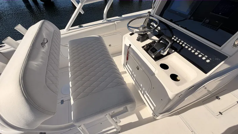 Slide: The Image of Interior view of a 2006 Dakota 36 Cuddy boat with helm console. - 5